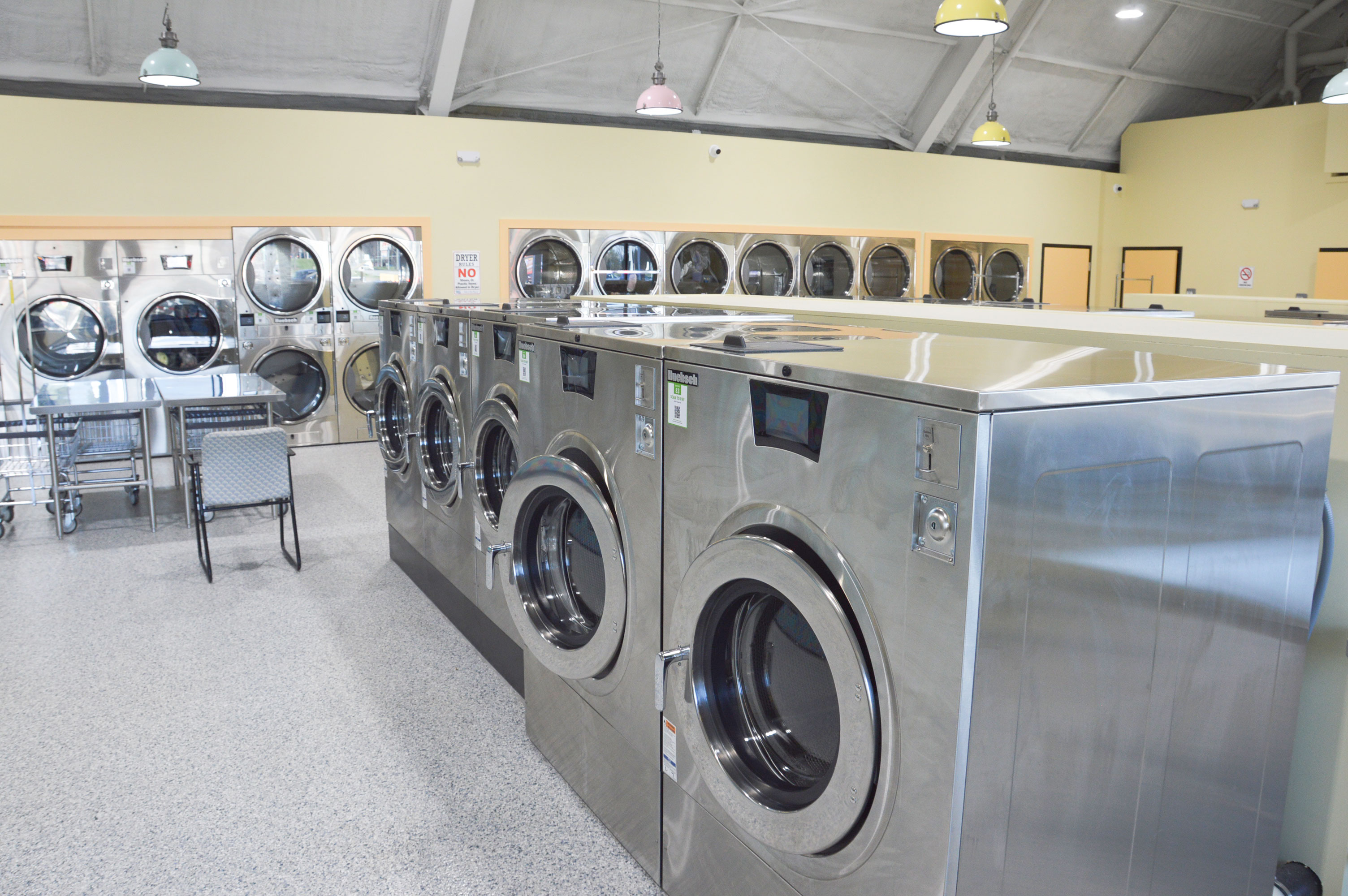 High-capacity washer aisle with 80 and 60 pound machines