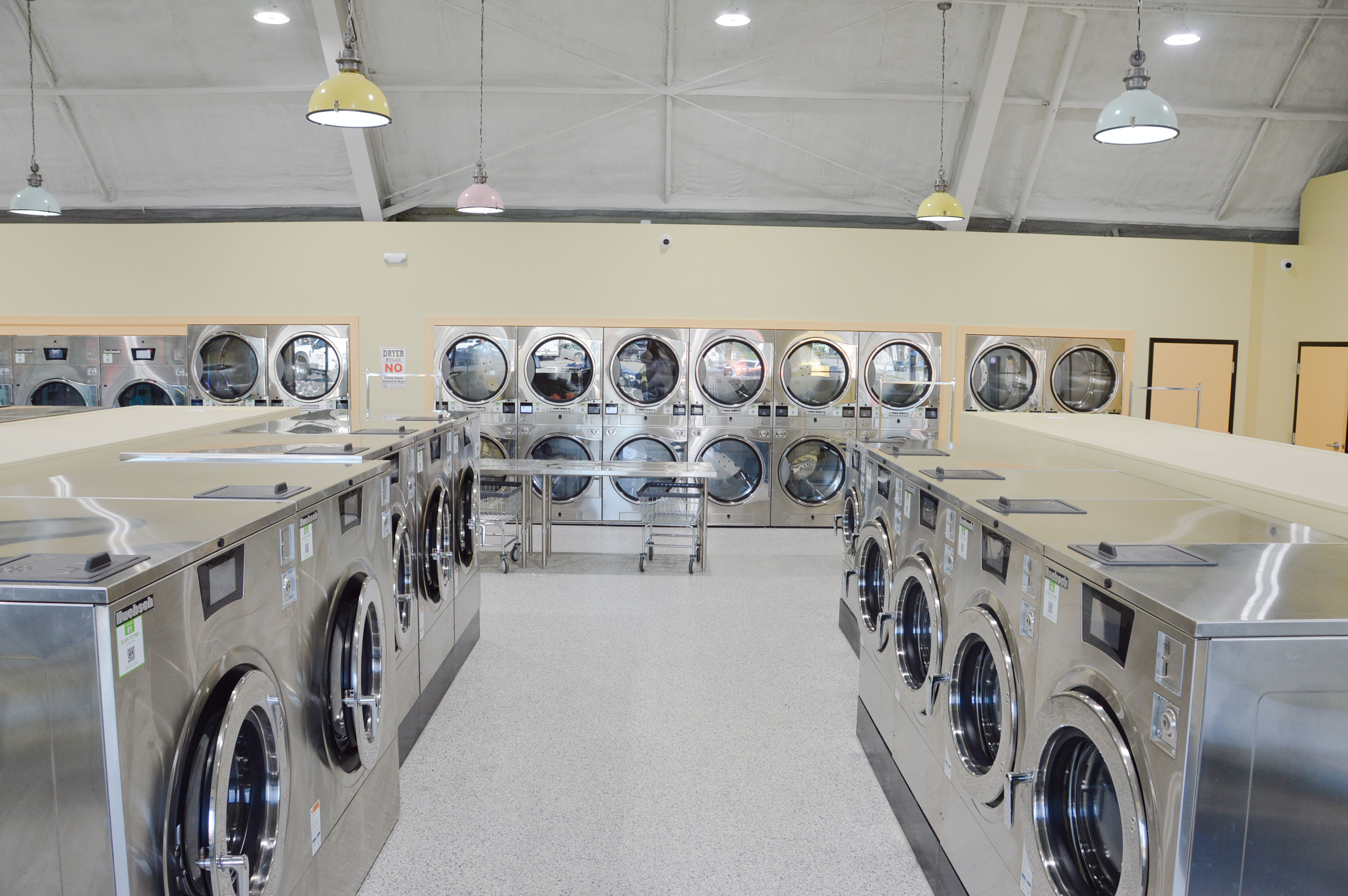 Folding tables and dryer area inside Bubbles & Bleach